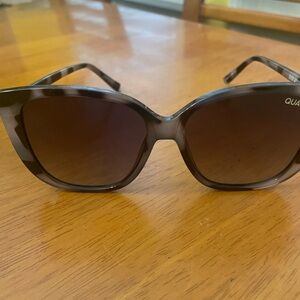 Gray Black tortoise  color sunglasses.